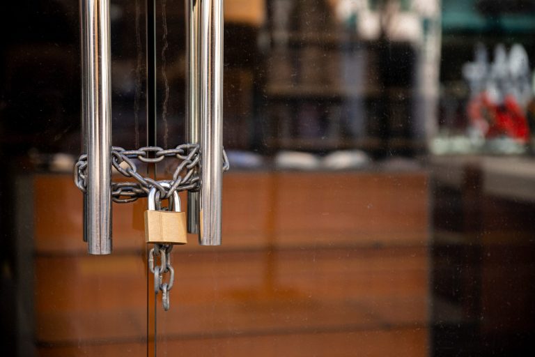 Closed,Store,Due,To,Coronavirus,Pandemic.,Locked,Store,Door,With