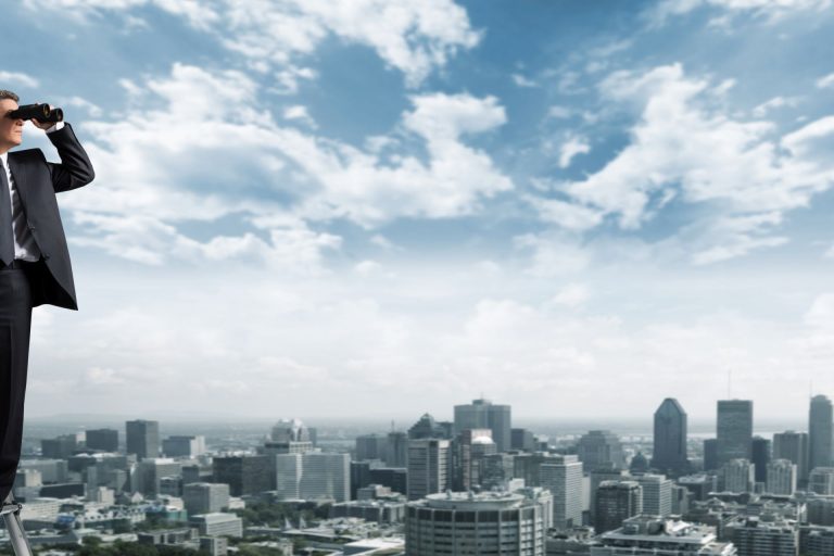 Business man with binoculars.